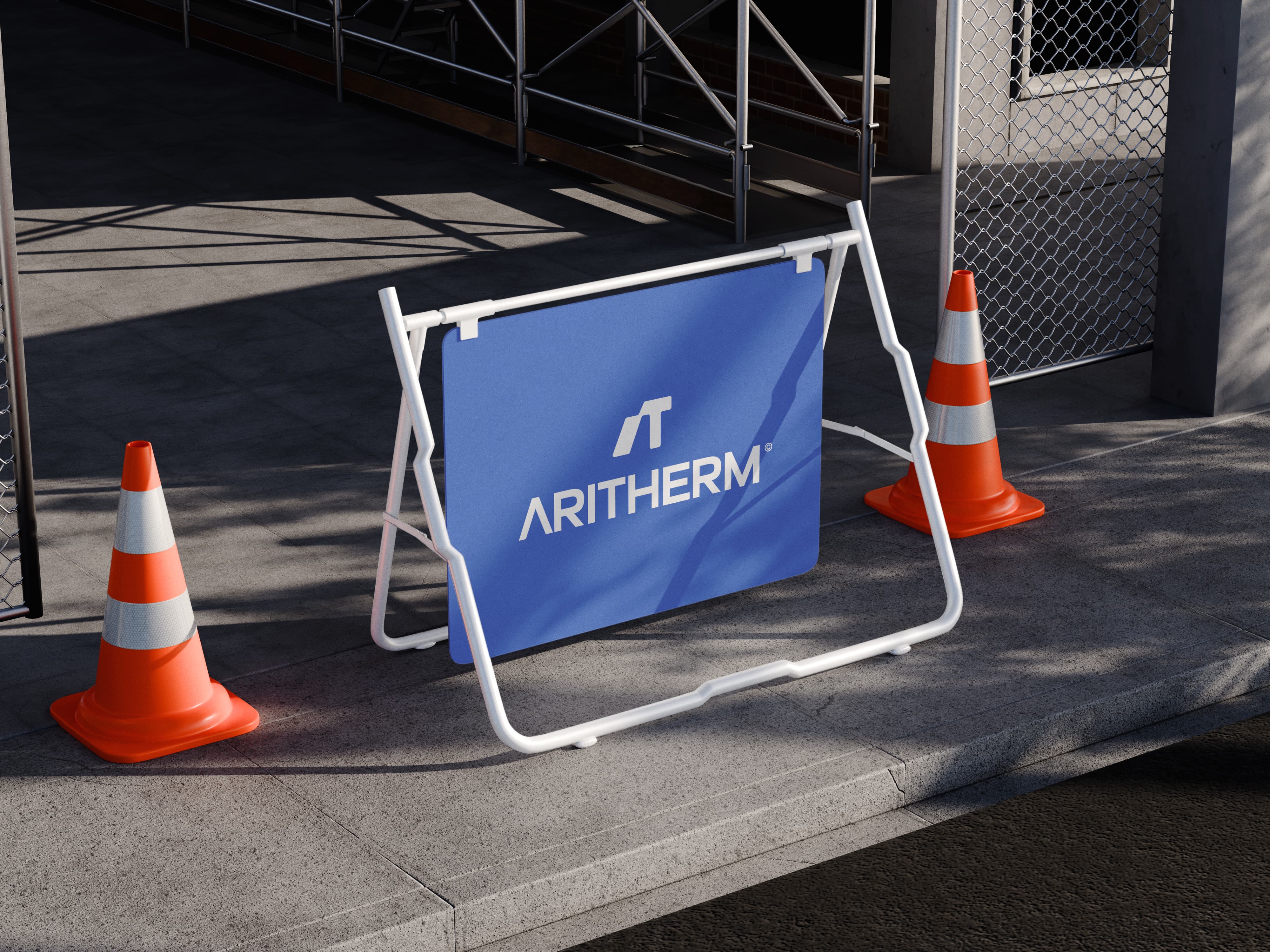 Aritherm branded construction barrier demonstrating the visual identity across outdoor signage and site materials.