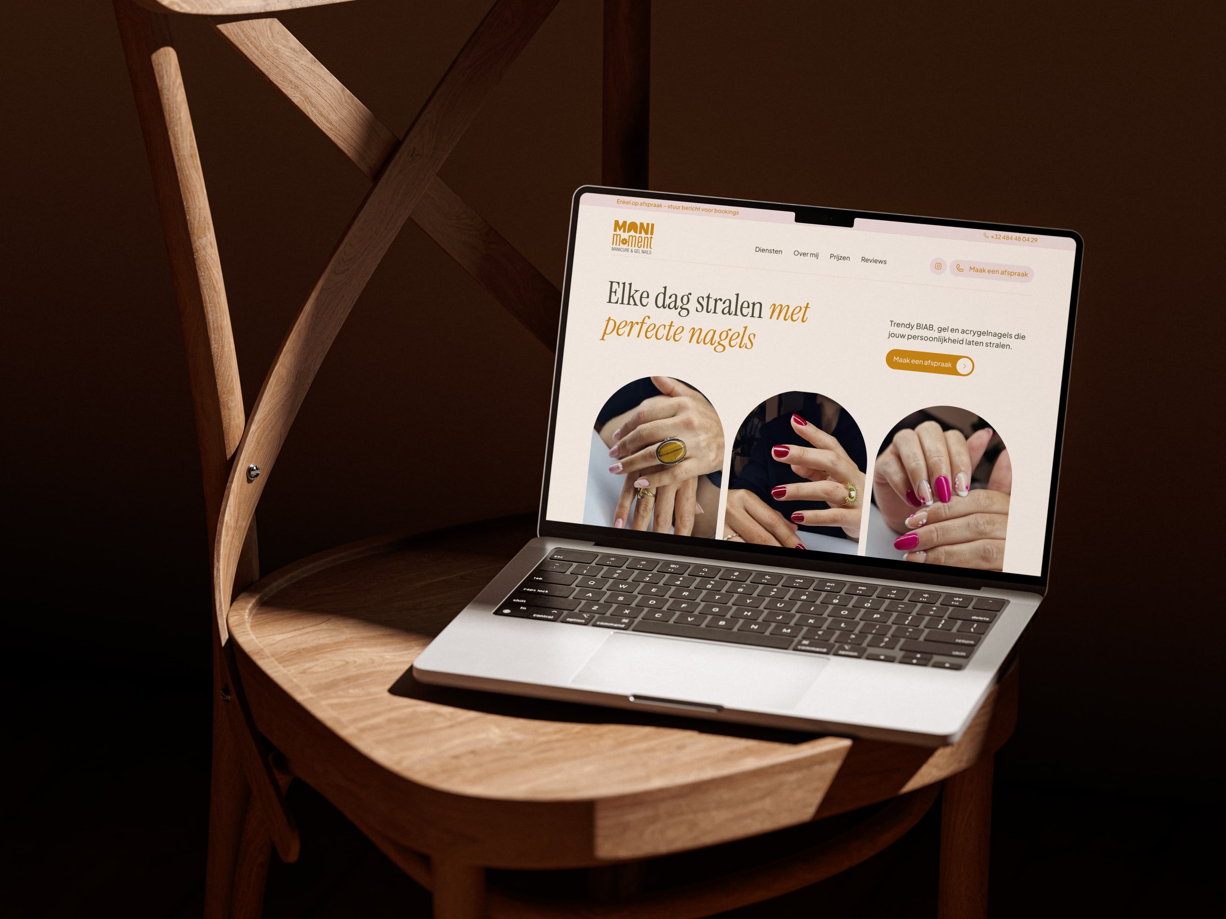 Homepage design for the Mani Moment nail studio website displayed on a laptop.